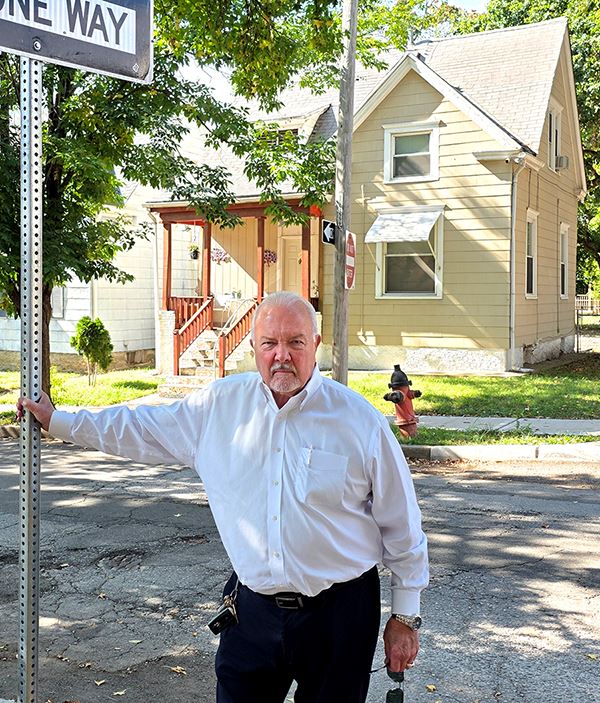 COMBAT Commission Chair Larry Beaty Outside Childhood Home
